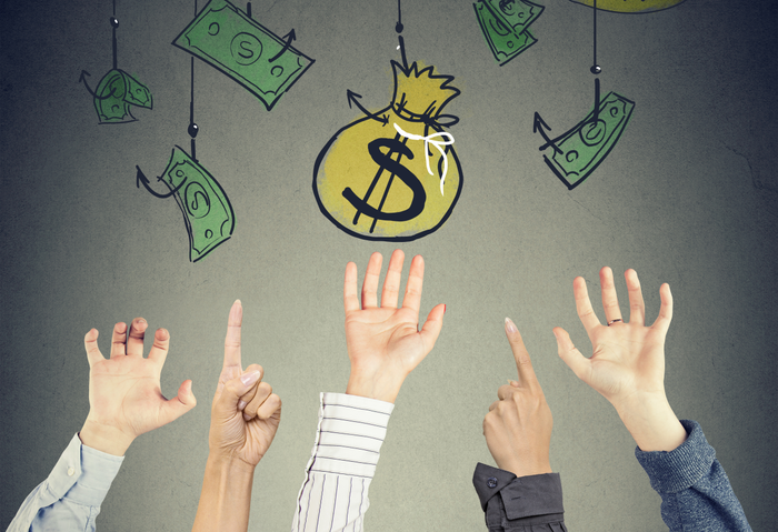 hands reaching for money symbols