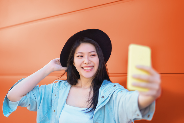 Trendy influencer having fun with new trends social networks apps